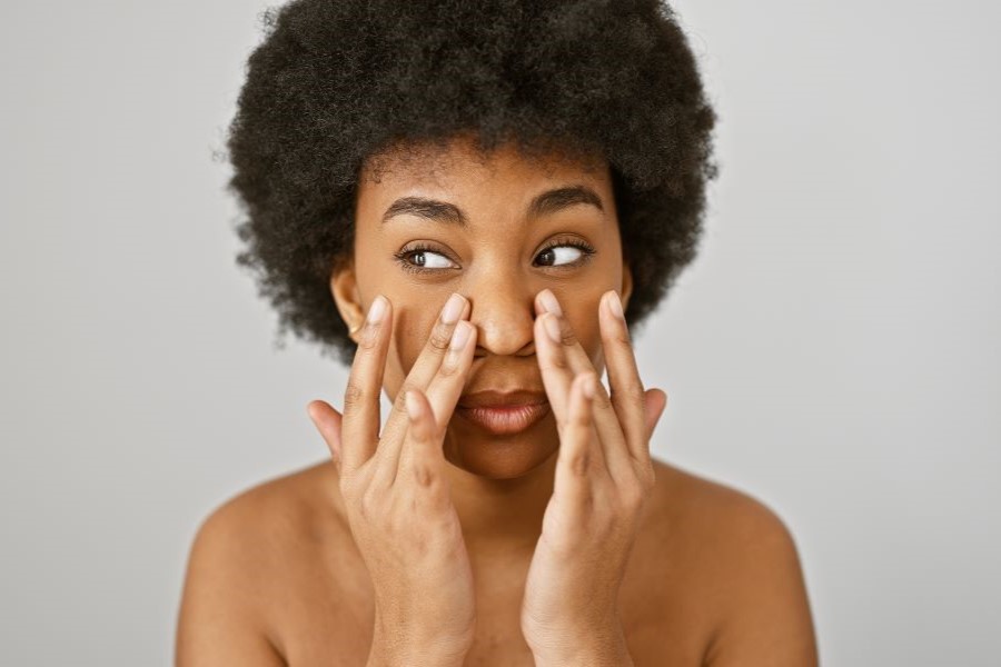 Woman touching her face